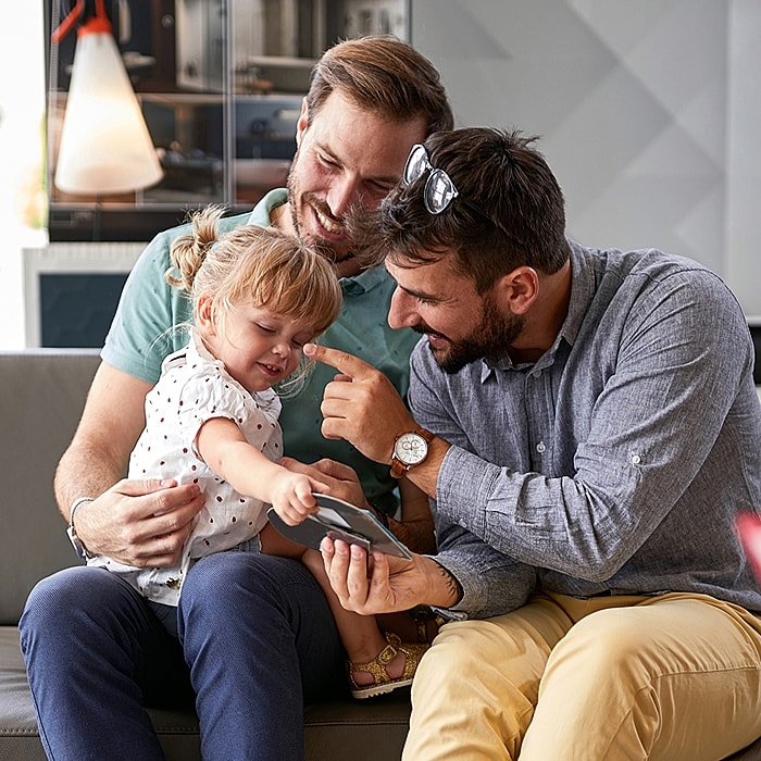 Family enjoying time together with a phone.