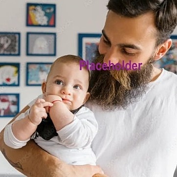 Father holding baby in a cozy setting.