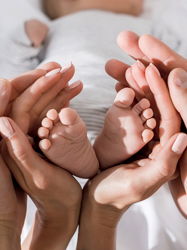 Pregnant woman forming heart shape with hands