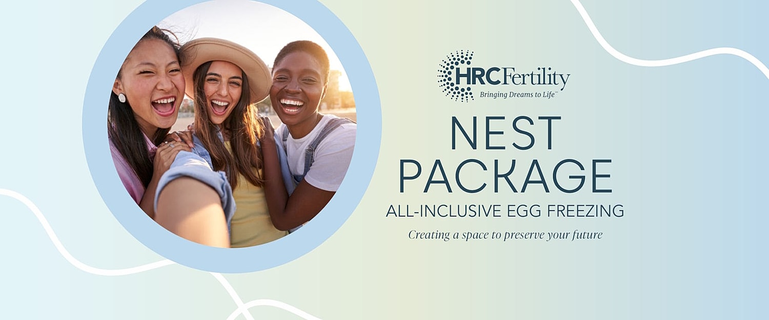 Three women smiling together for egg freezing promotion.
