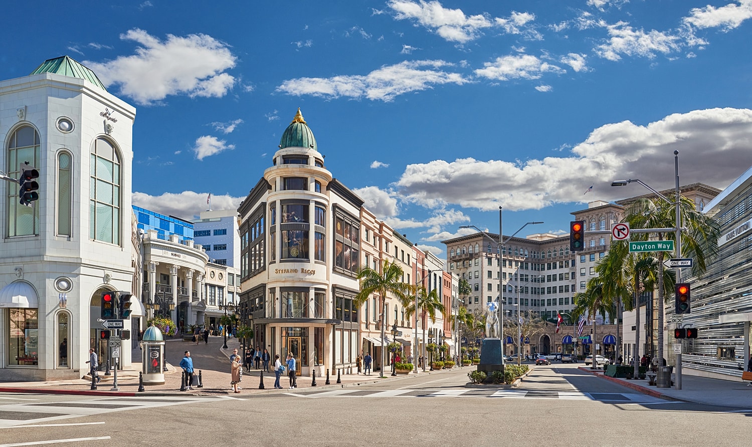 Upscale shopping district with clear blue sky.