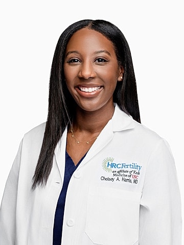 Smiling doctor in lab coat, professional portrait.