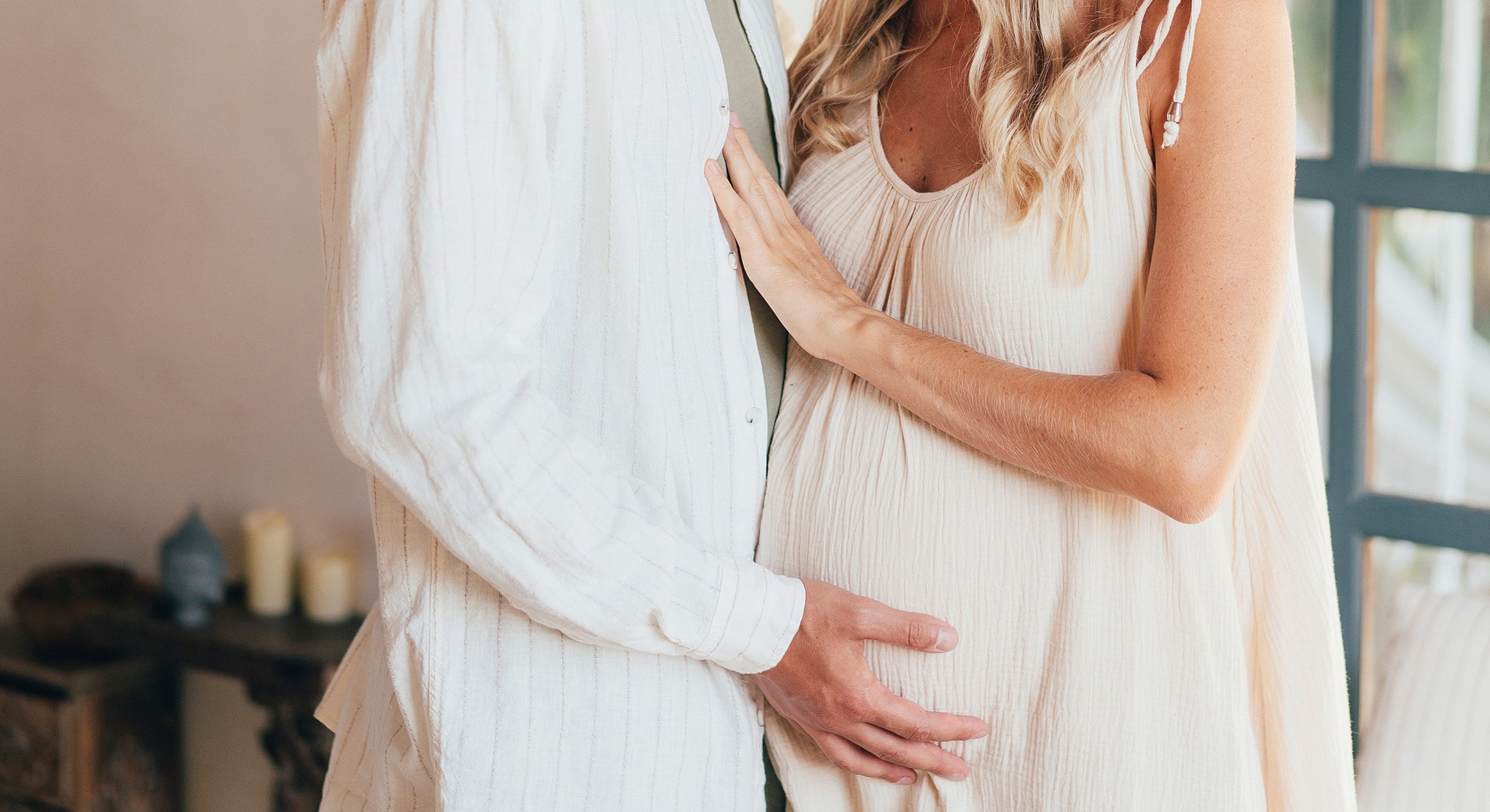 Expectant couple celebrating pregnancy moment together.
