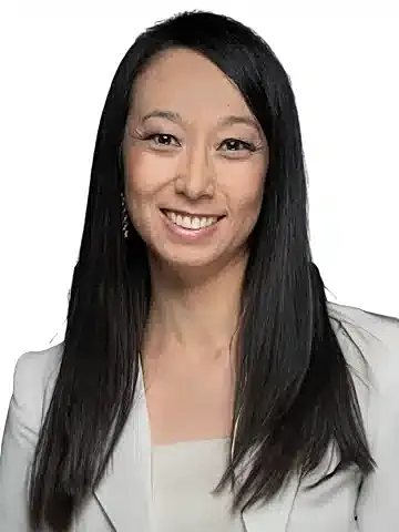 Professional woman smiling in a blazer.
