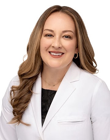 Smiling healthcare professional in a white coat