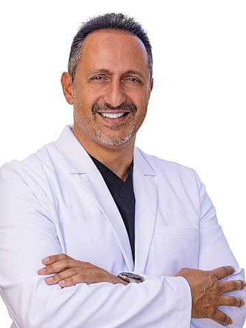 Smiling doctor in a white lab coat.