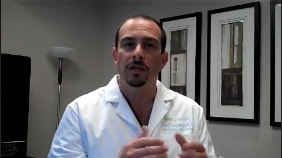 Medical professional presenting in an office setting.