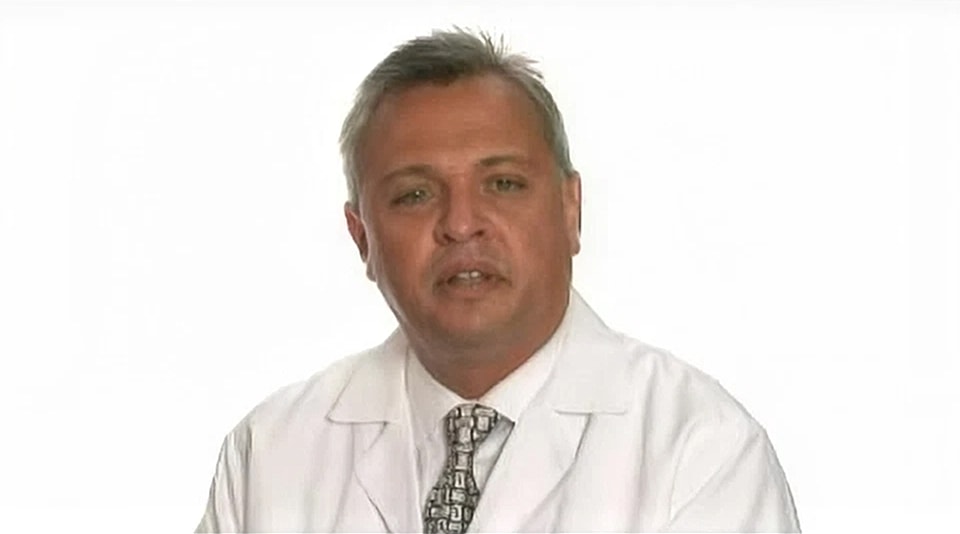 Medical professional speaking on a white background.